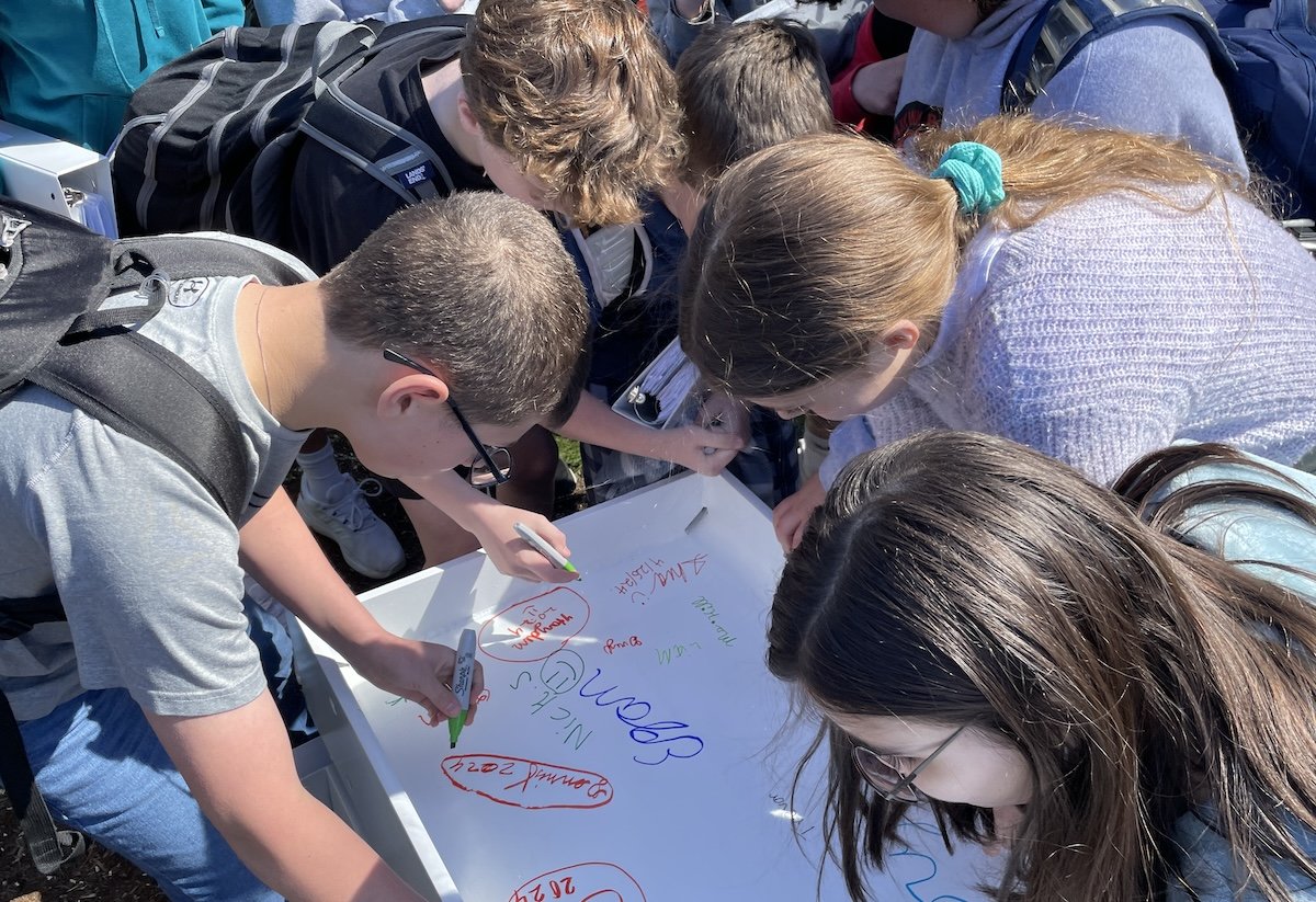 Landmark students sign beam_1